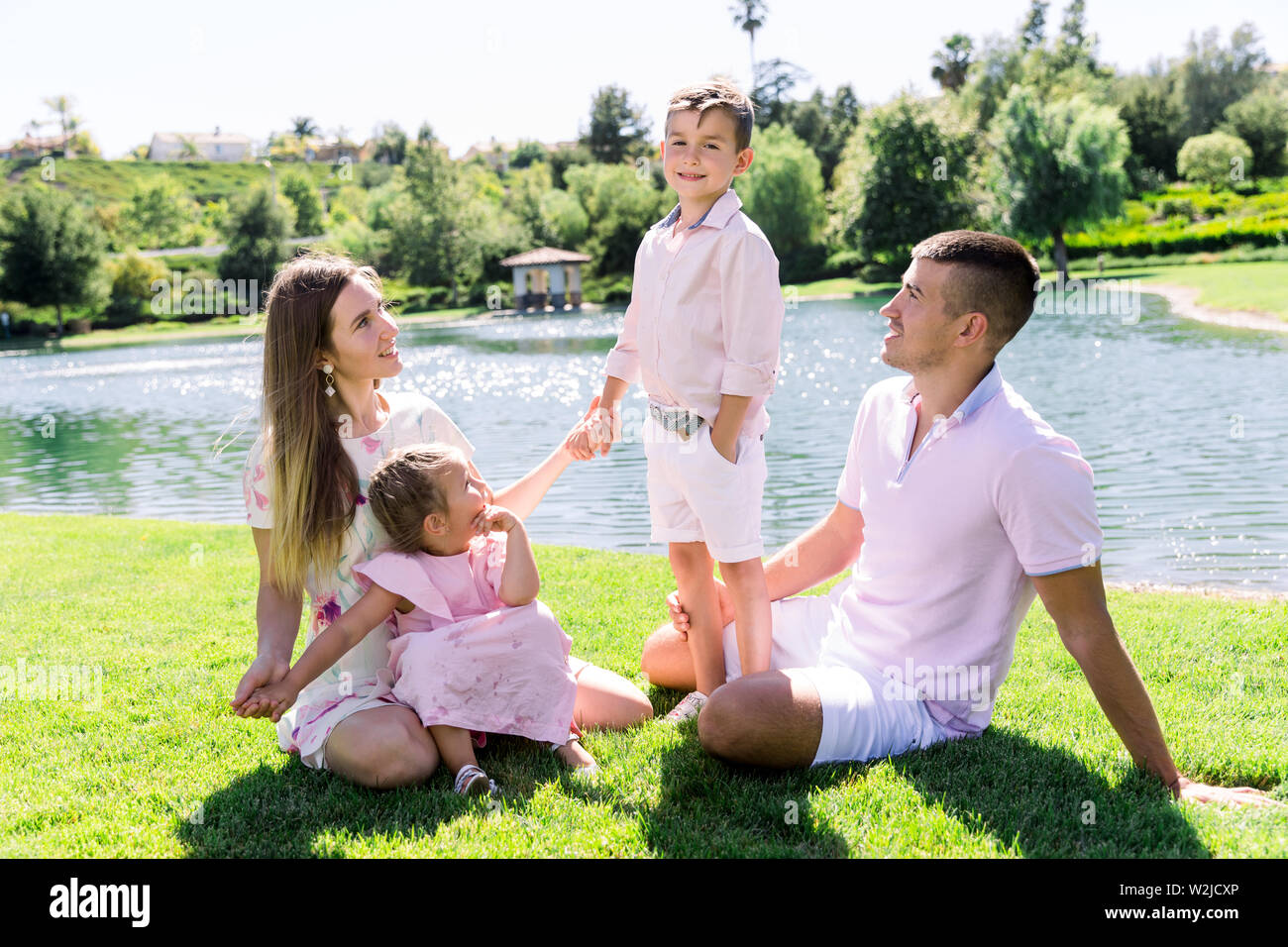 Happy family at the park having a good time together Stock Photo - Alamy