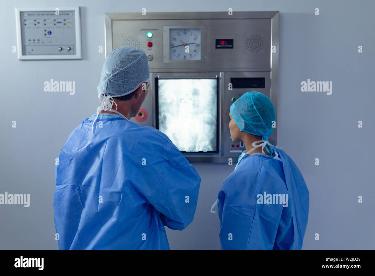 Surgeons examining x ray on xray light box at hospital Stock Photo Alamy
