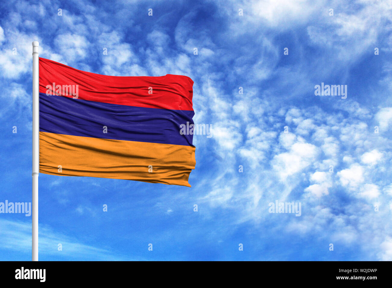 National flag of Armenia on a flagpole in front of blue sky Stock Photo ...