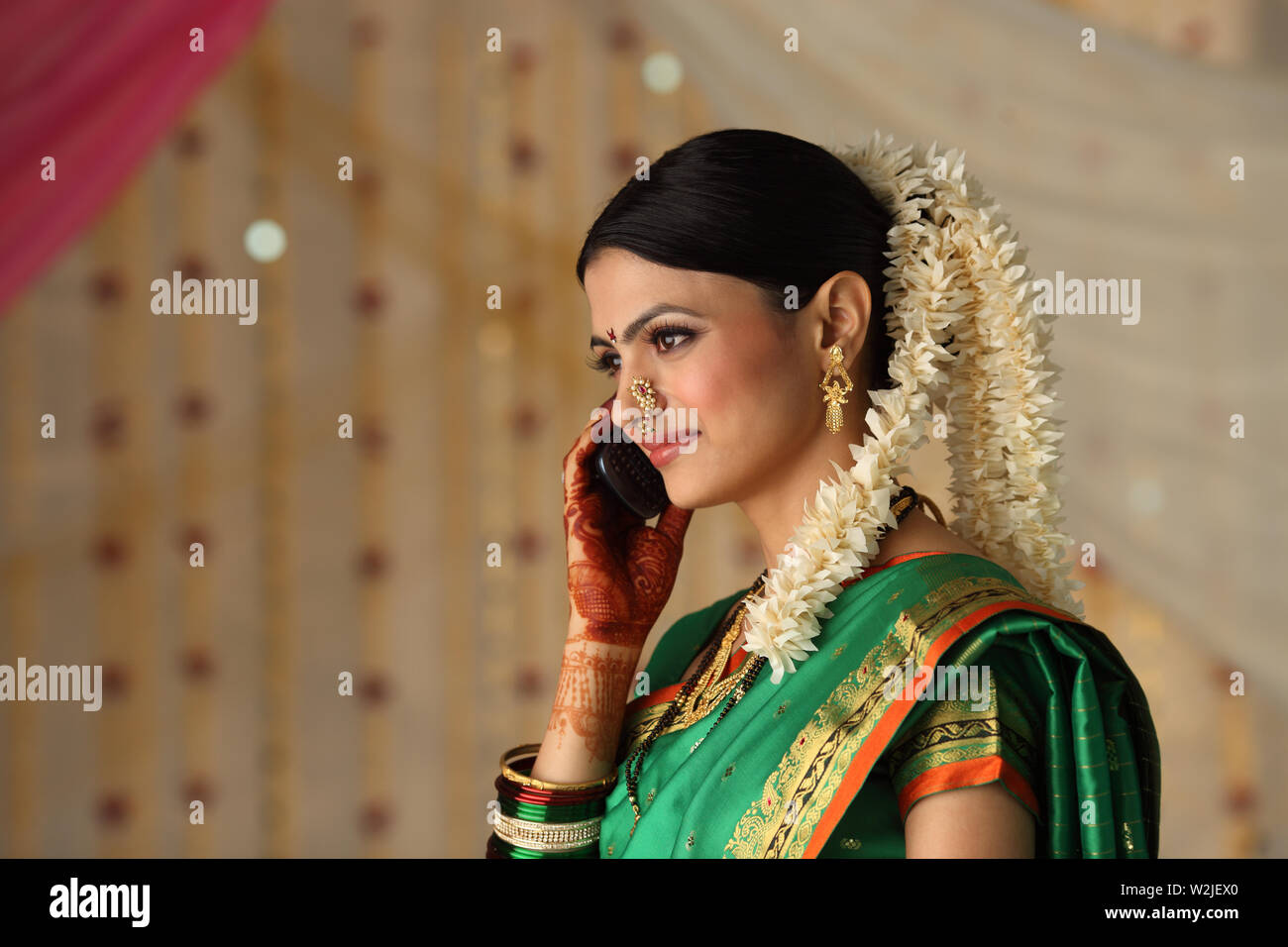 Indian young Woman talking on a mobile phone Stock Photo - Alamy