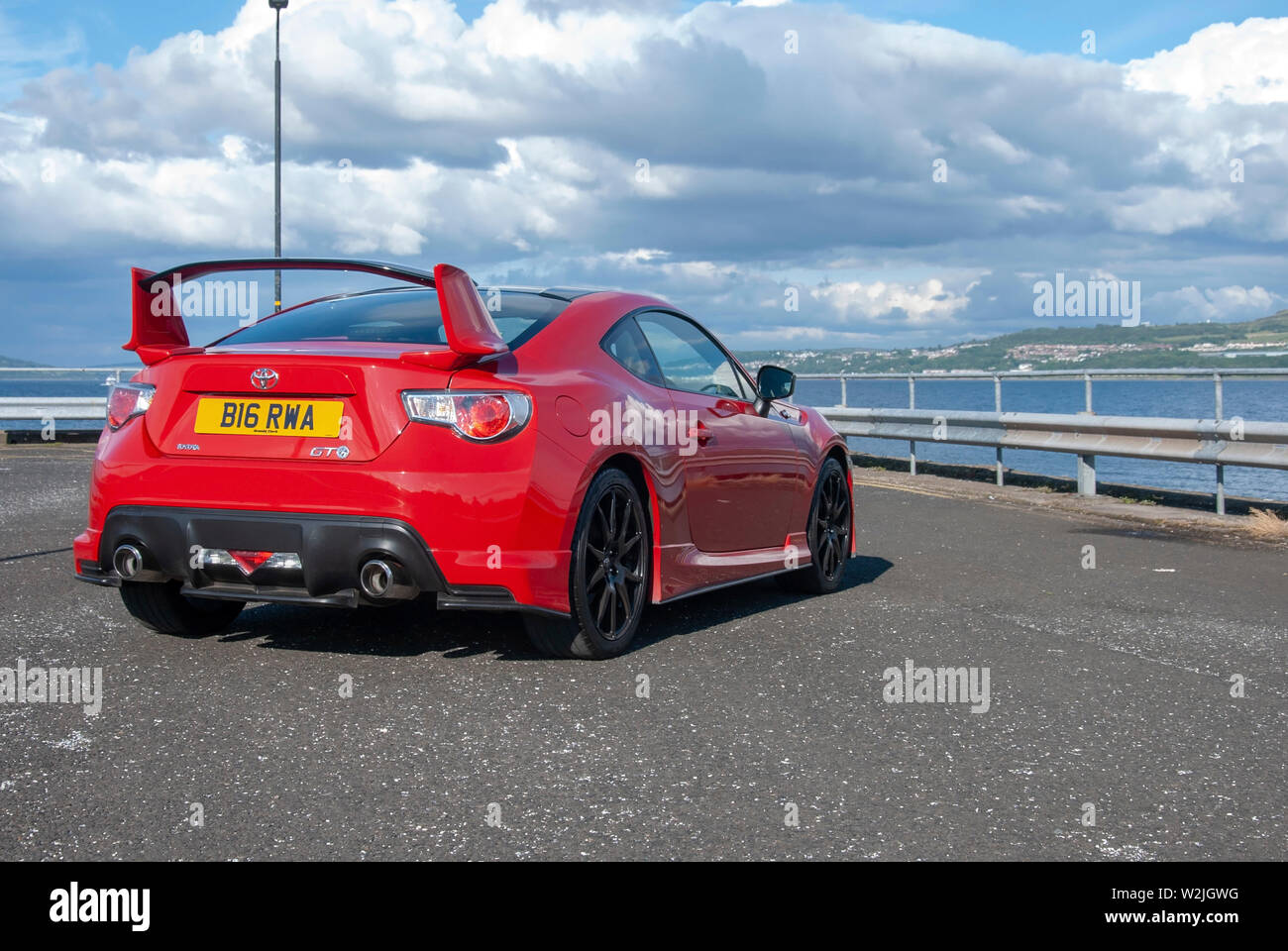 2015 Model Bright Red Toyota GT 86 Aero Sports Car rear right hand drivers  side offside view of 2 two door rhd right hand drive bright red toyota gt 8  Stock Photo - Alamy