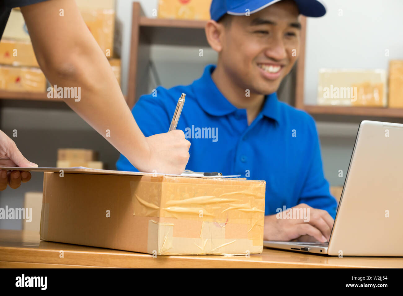 Employees receive parcels from customers and writing addresses for