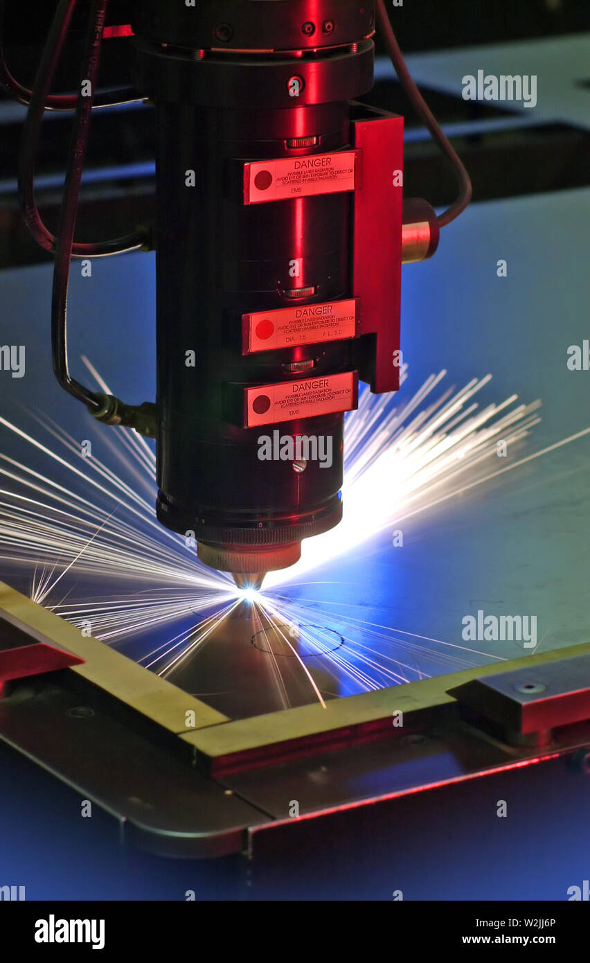 Save Download Preview Laser cutting. Metal machining with sparks on CNC laser  maching Stock Photo
