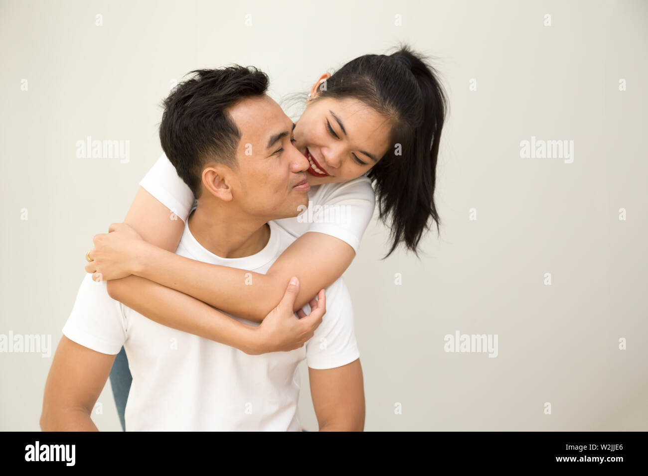 Happy Asian couple hugging and in love, Valentines day concept Stock Photo