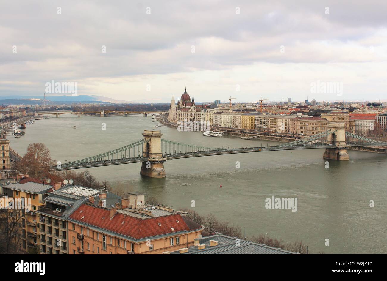 A  view looking up the river Danube in Budapest, from the Buda side, of the 'Chain Bridge', the 'Margaret Bridge', and the Pest side of the city. Stock Photo