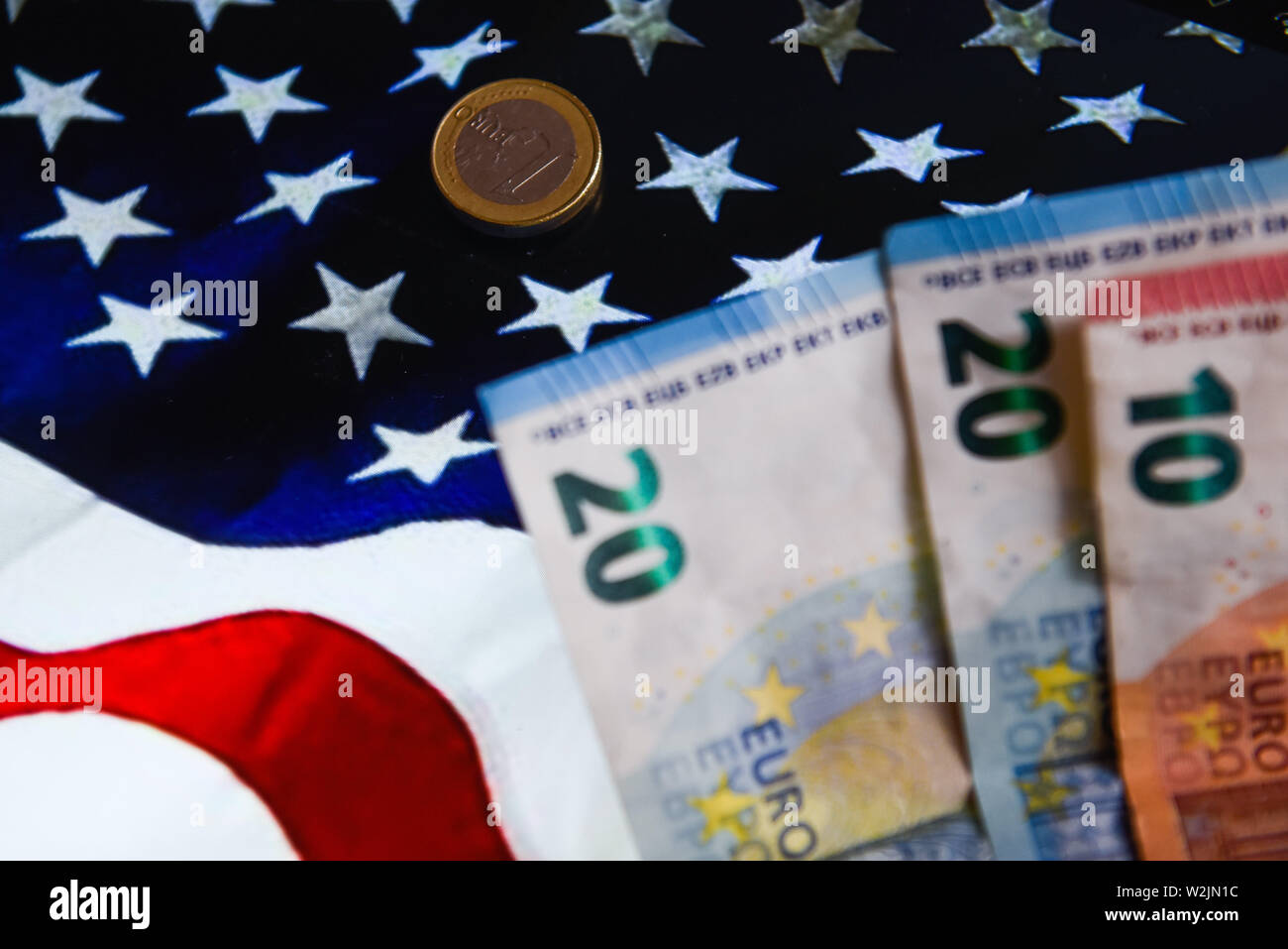 Poland. 9th July, 2019. In this photo illustration the twenty and ten euros bank notes are seen with United States of America flag on the background. Credit: Omar Marques/SOPA Images/ZUMA Wire/Alamy Live News Stock Photo