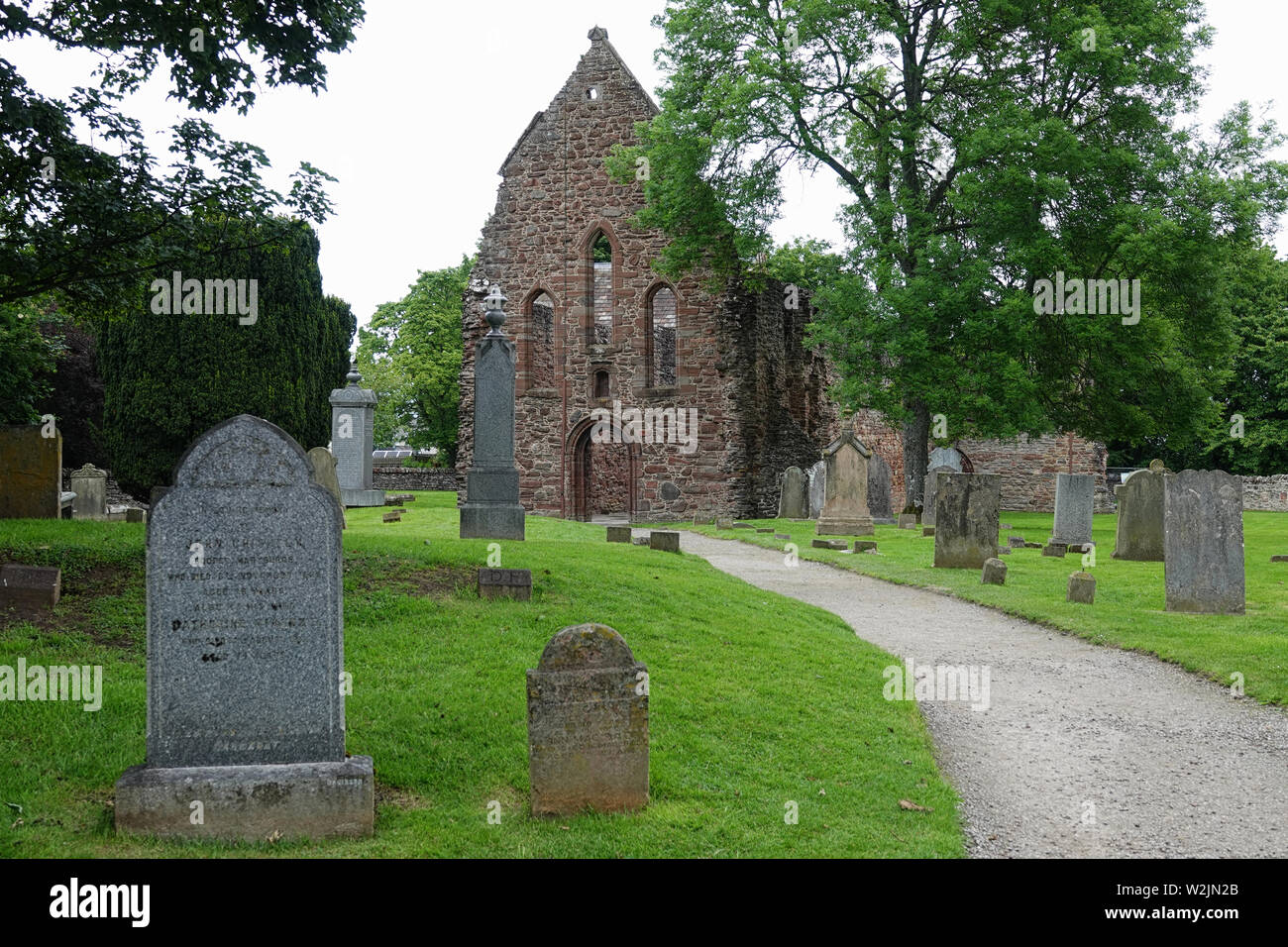 The Beauty Priory cemetery and church ruins - originally built in the 1200s AD in Inverness-shire, Scotland - are shown during an afternoon day. Stock Photo