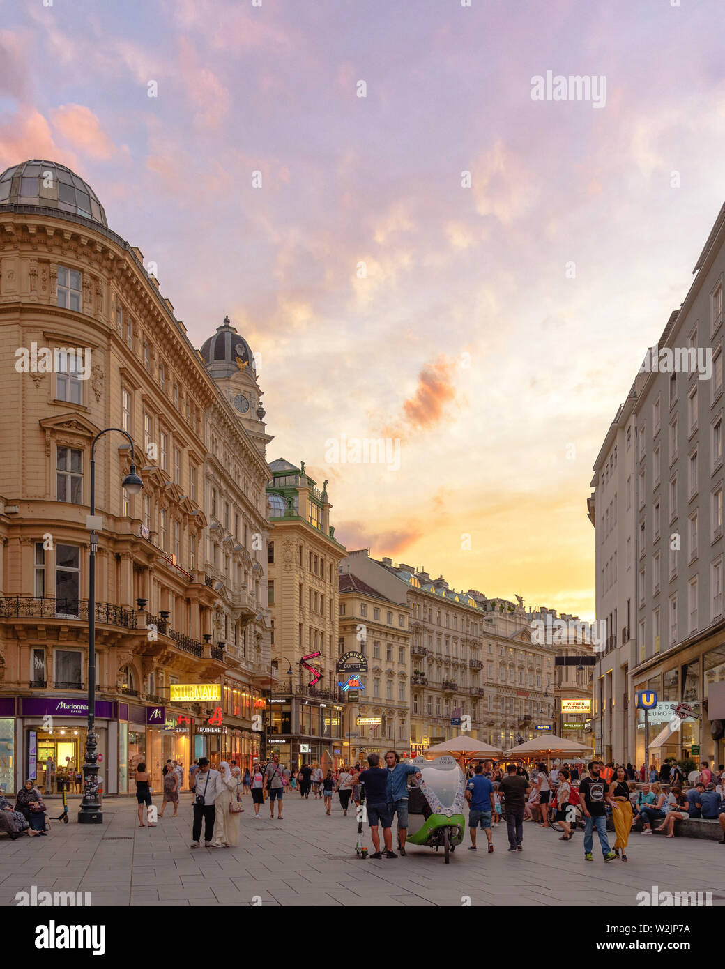 Pedestrians walking along the Graben in Vienna, Austria on a summer evening at dusk Stock Photo