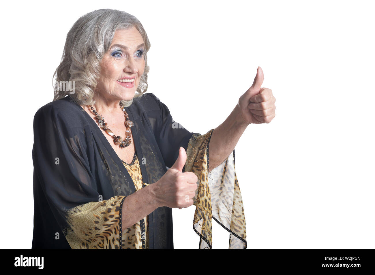 Portrait of happy senior woman with thumbs up Stock Photo - Alamy