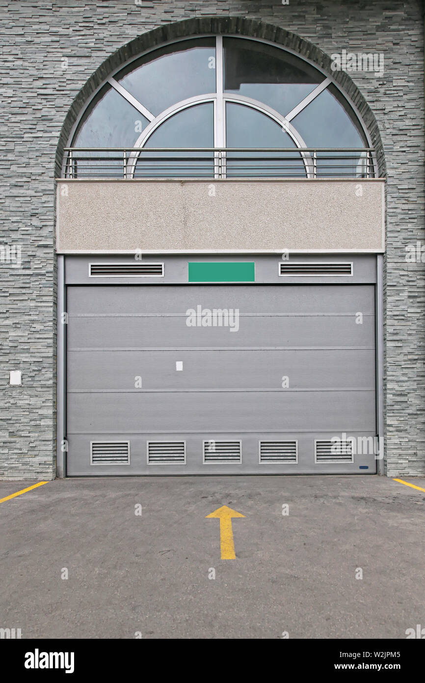 Closed Grey Garage Door Car Entrance With Arch Stock Photo - Alamy