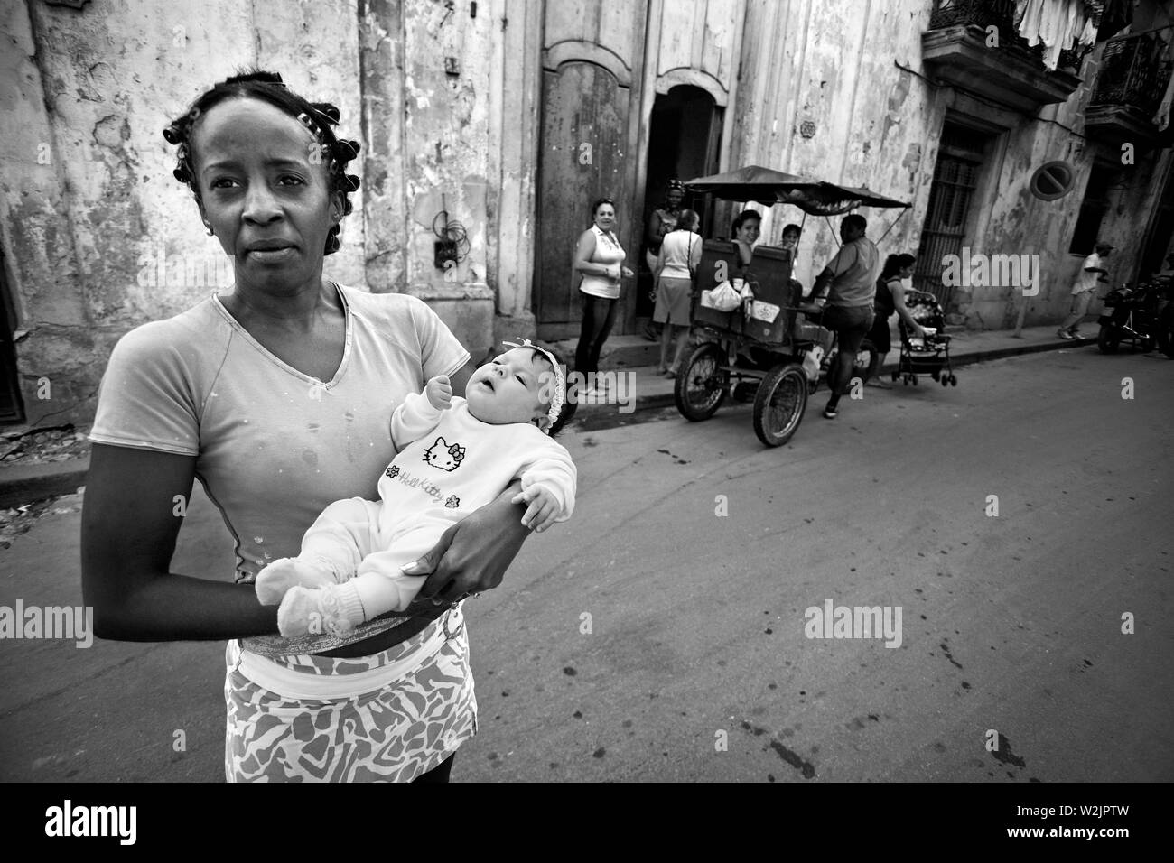 Black woman holding white baby hi-res stock photography and images - Alamy
