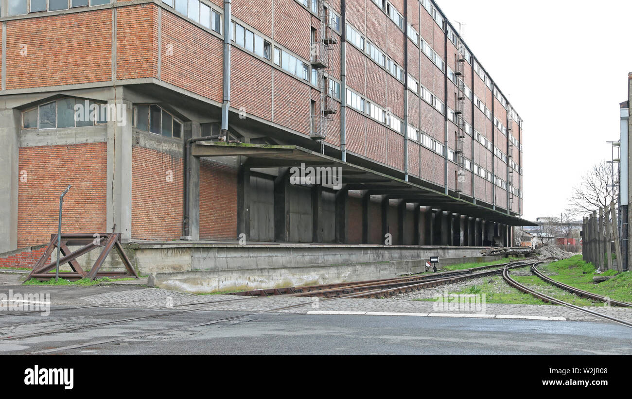 Big Warehouse Building With Railway Loading Dock Stock Photo - Alamy