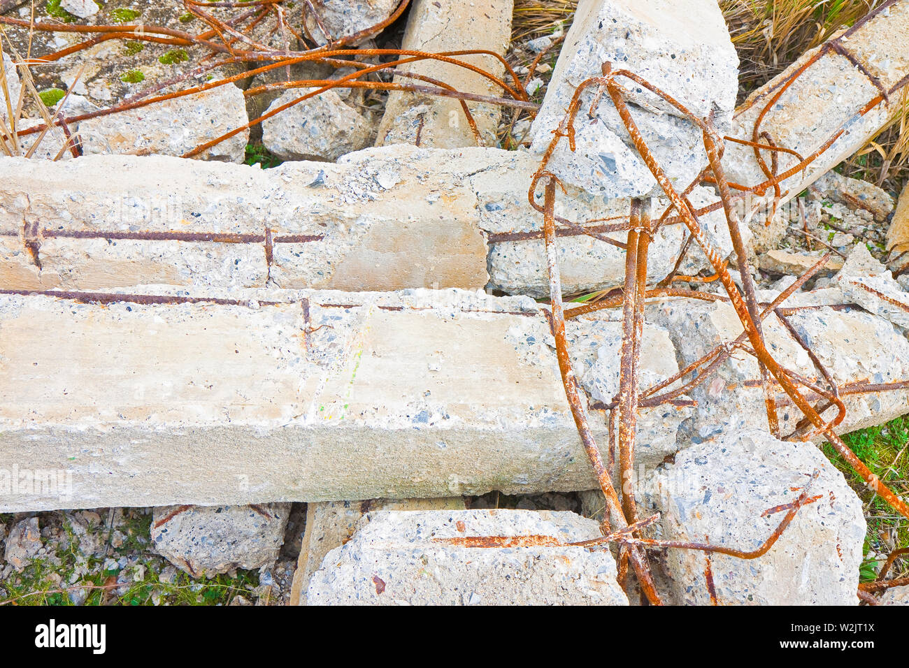 Collapsed reinforcement concrete structures with rusty steel bars in a construction site - concept image Stock Photo