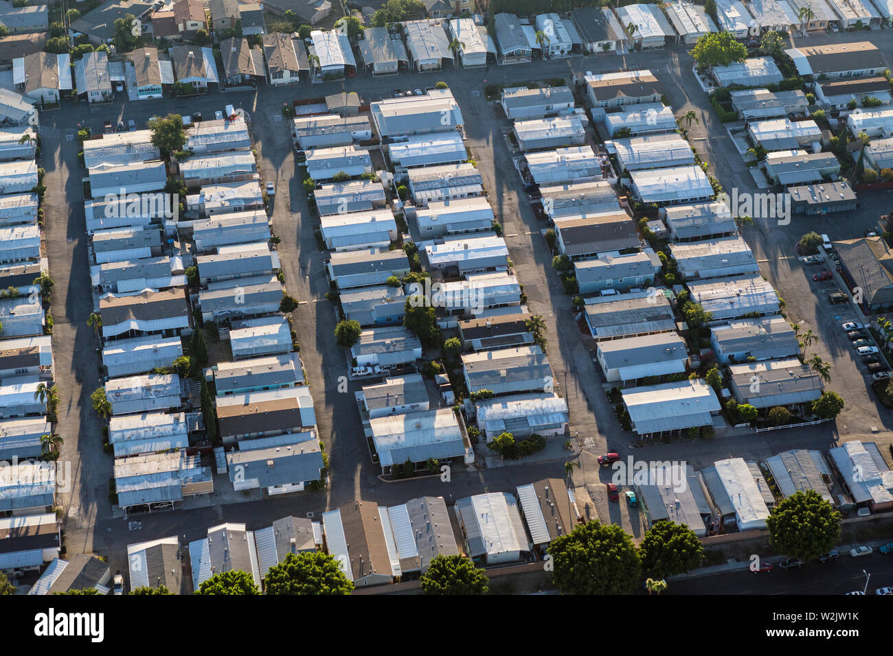 Aerial view of generic older mobile home rooftops in the southwest United States. Stock Photo