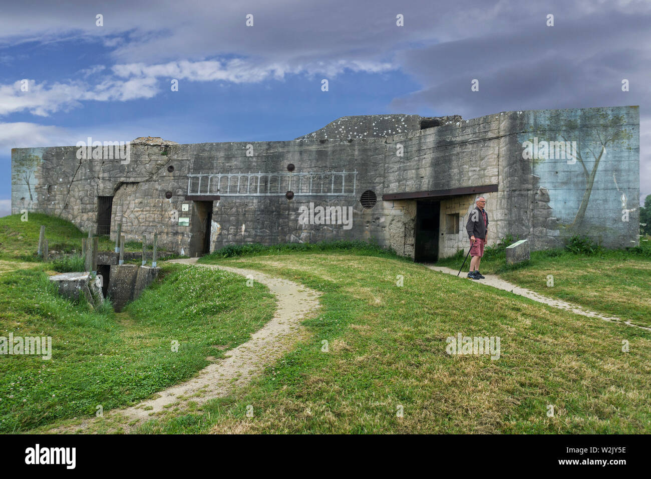 Camouflage painting on rear of gun casemate / artillery bunker of WWII Batterie d'Azeville Battery, part of German Atlantic Wall, Normandy, France Stock Photo