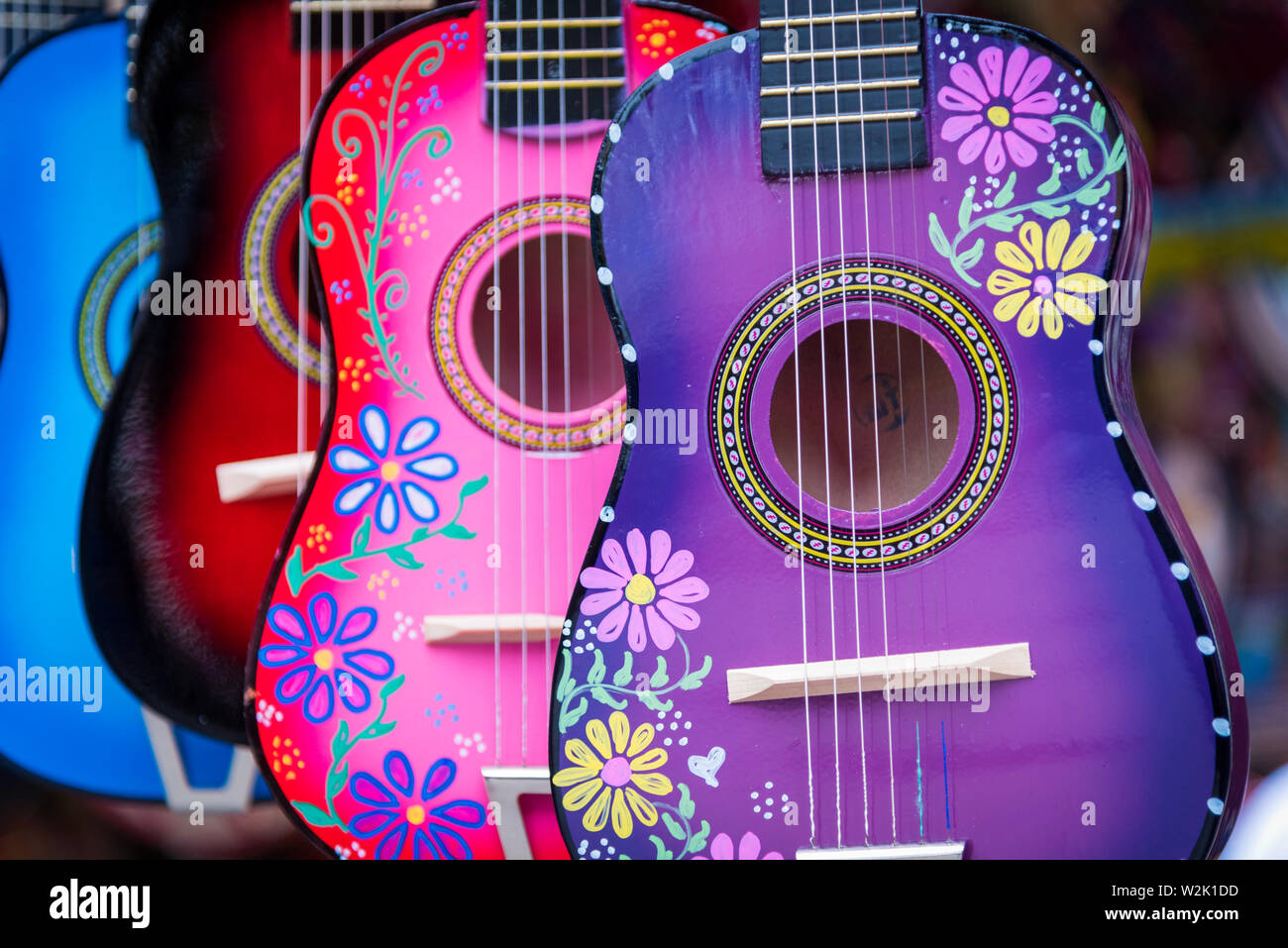 A group of colorful painted mexican made guitars Stock Photo