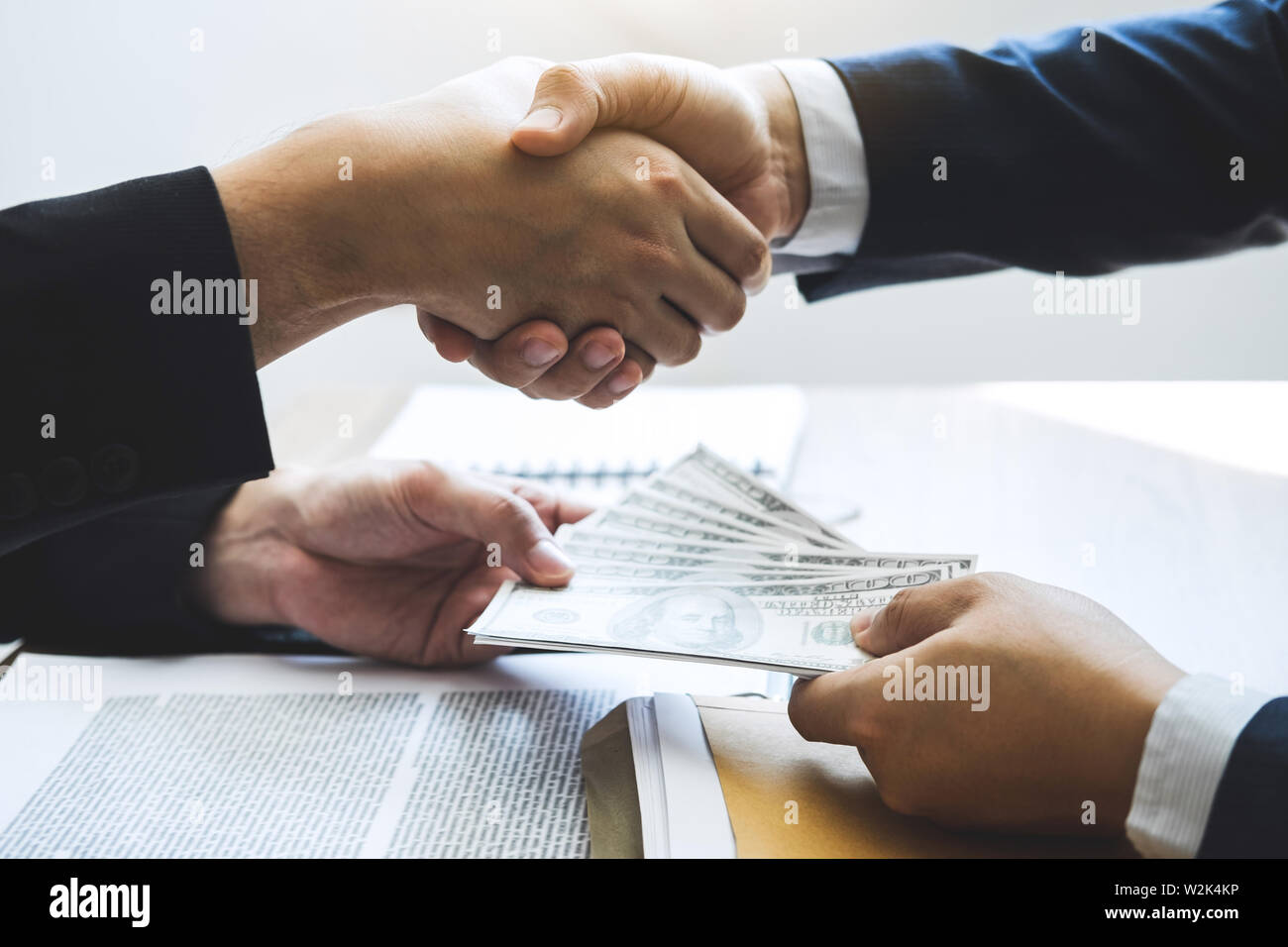 Dishonest cheating in business illegal money, Businessman handshake