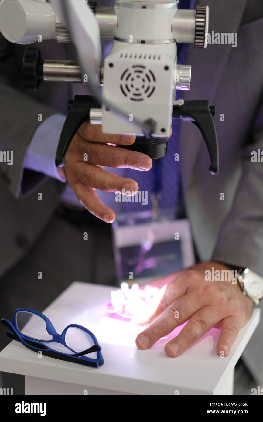 Microscope on the stand of the manufacturer of optical products at the