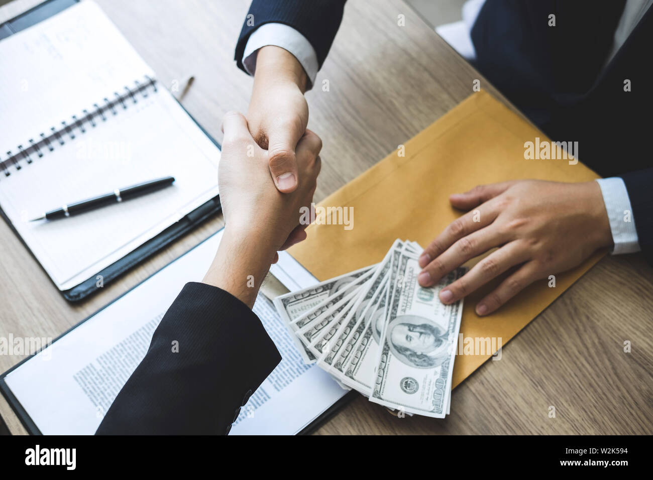 Dishonest cheating in business illegal money, Businessman handshake