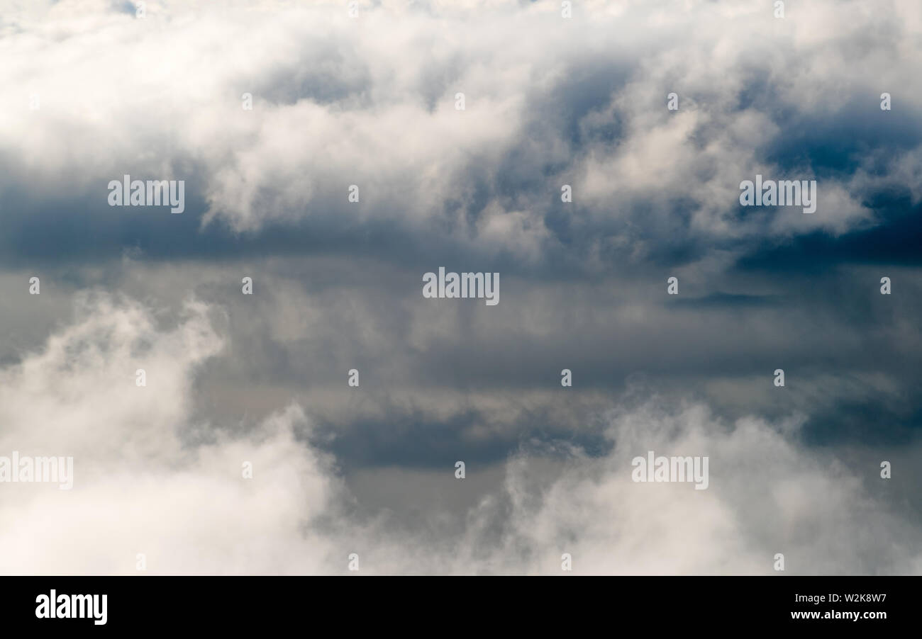Dark stormy rain clouds in the sky. Dramatic rain cloud background without land, bad weather Stock Photo