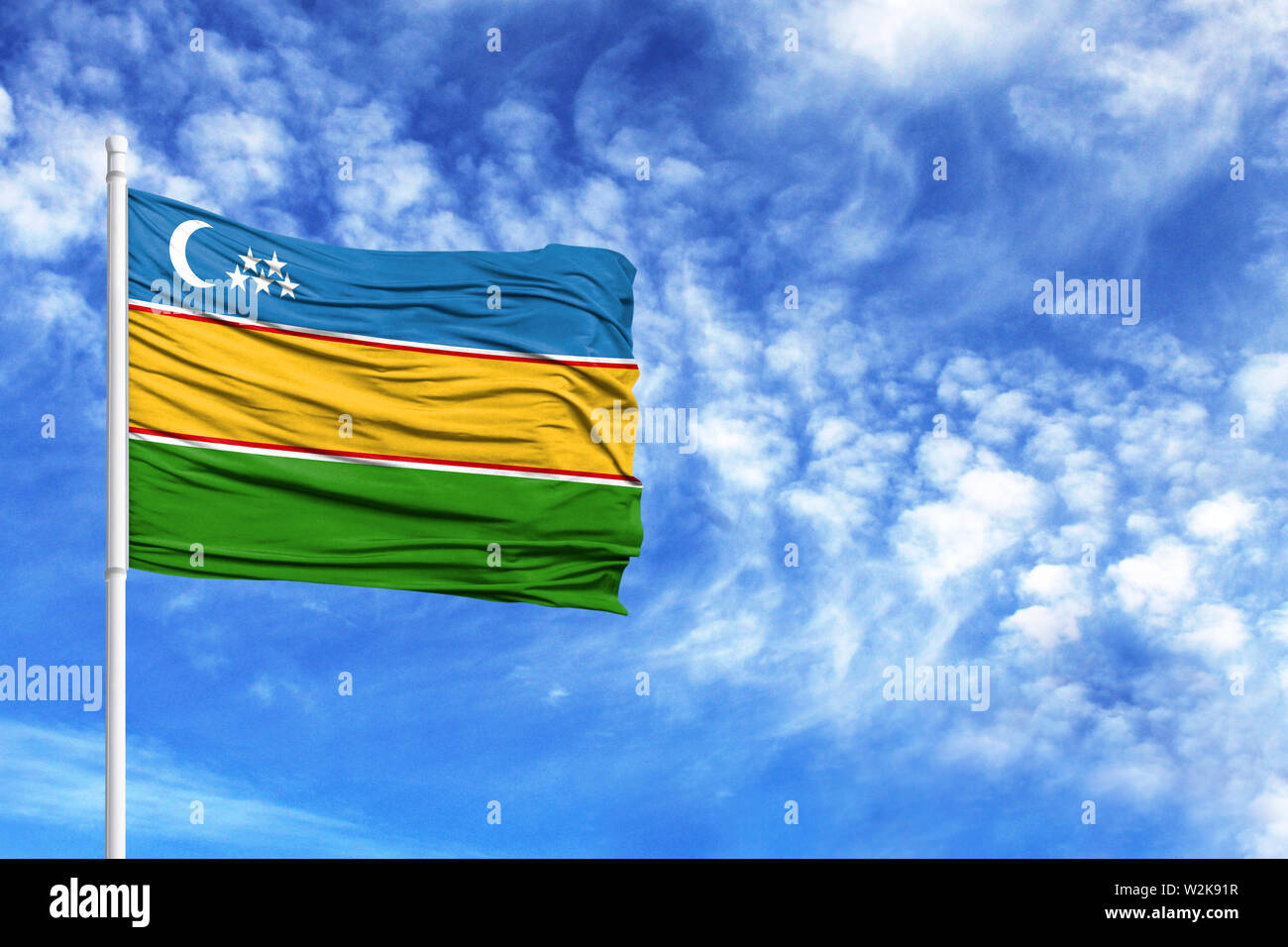 National flag of Karakalpakstan on a flagpole in front of blue sky