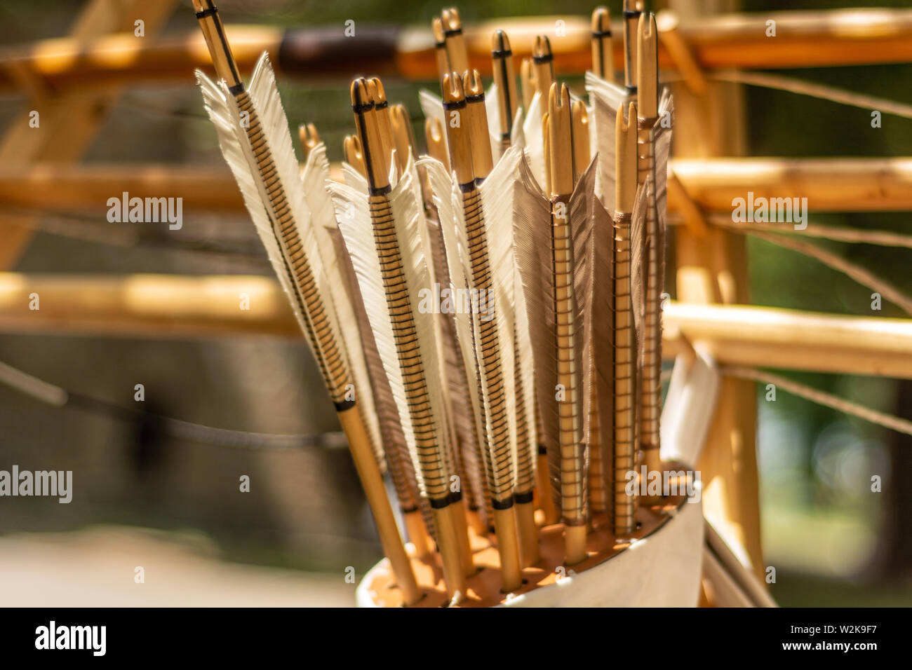 Handcrafted arrows in a brown leather quiver full with arrows in