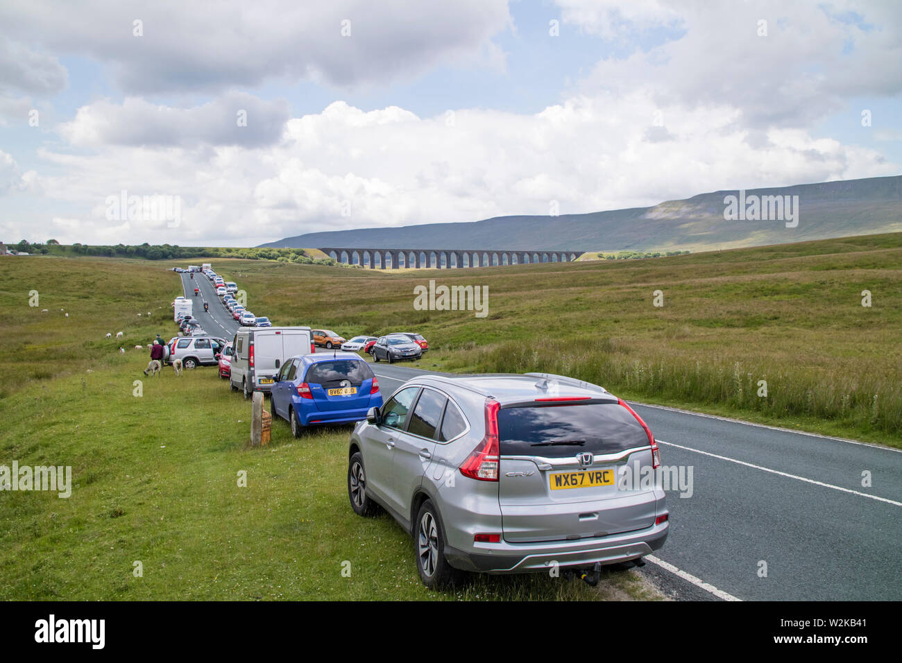 Cars parked on the roads near the Ribblehead Viaduct on the Settle
