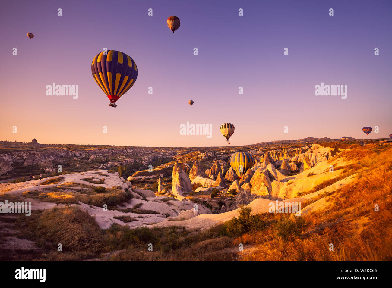 Hot air balloon flying over spectacular Cappadocia Stock Photo
