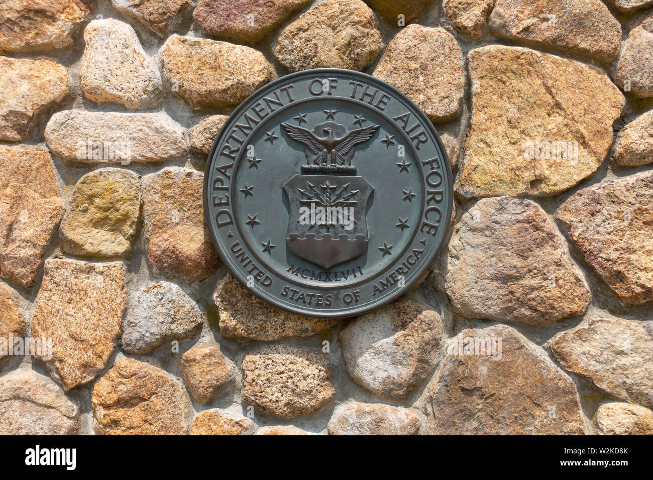 United States Department of the Air Force brass emblem plaque on stone wall at National Cemetery in Bourne, Cape Cod Massachusetts Stock Photo