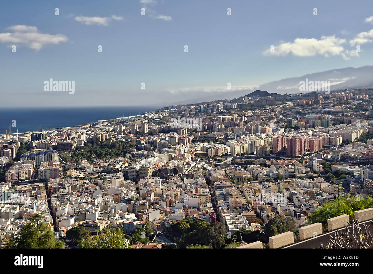 View of the capital Santa Cruz de Tenerife from the Mirador de los Campitos in the evening sun and blue sky. Stock Photo