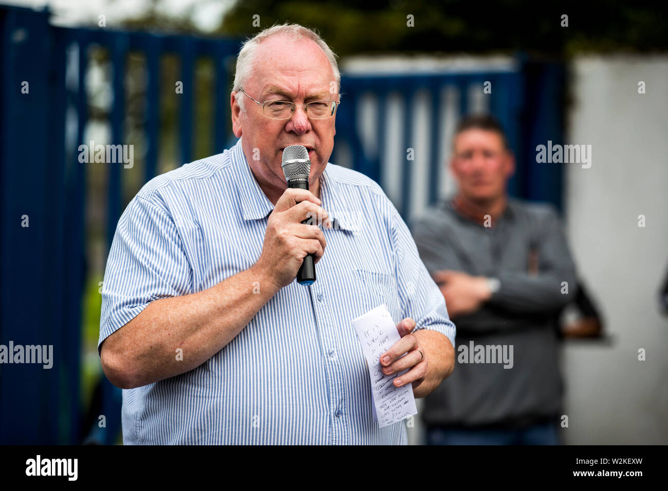 Orange Order grand secretary Mervyn Gibson addresses supporters of the 11th Night bonfire at Avoniel Leisure Centre in Belfast, Northern Ireland, who have gathered together to mark the anniversary of the Battle of the Boyne. Stock Photo