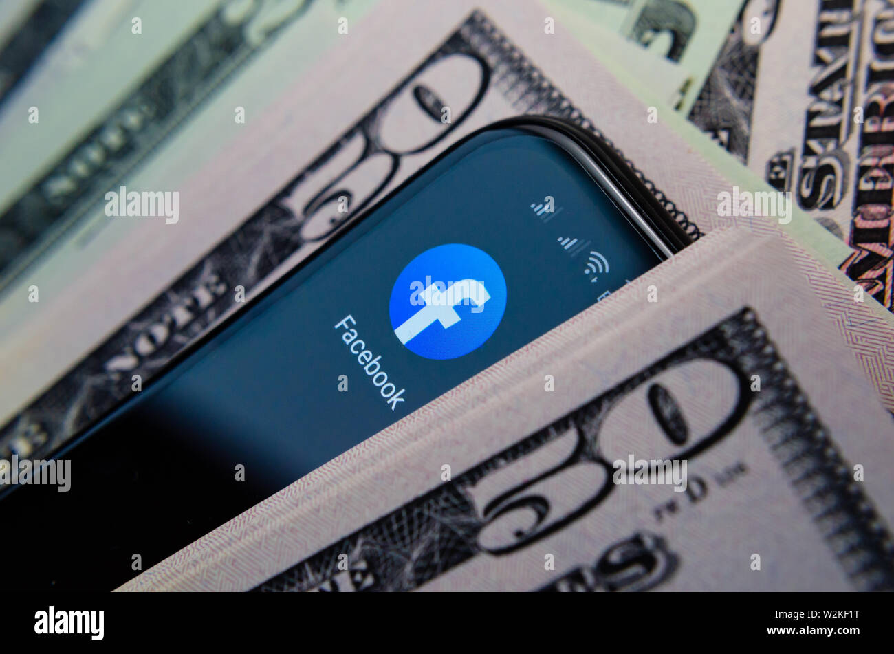 Facebook app icon and 50 dollar banknotes. Illustrate the news about ...
