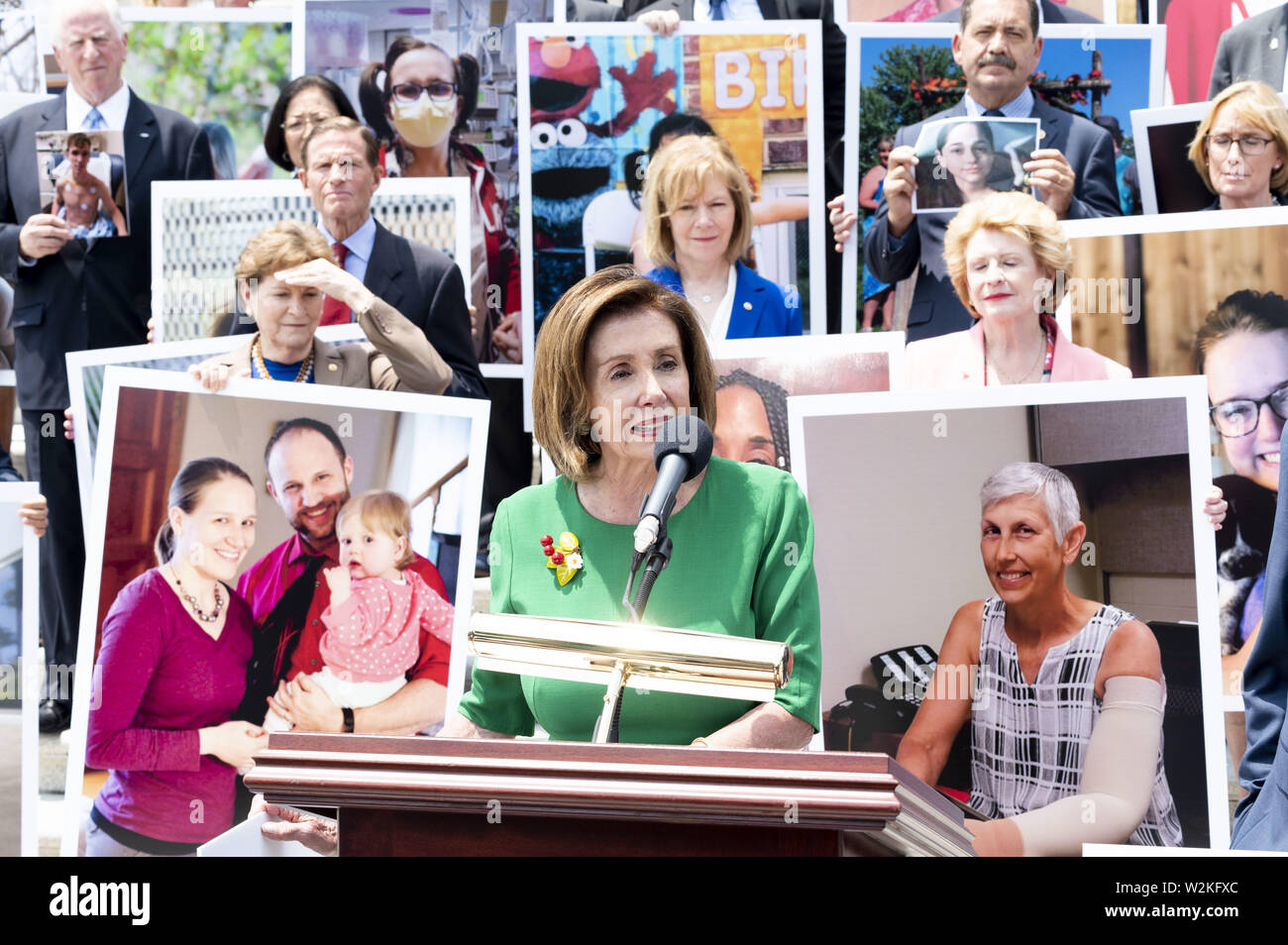 Washington, D.C, USA. 9th July, 2019. U.S. Representative NANCY PELOSI (D-CA) in front of a group of Democratic Senators and Representatives on the steps of the U.S. Capitol speaking against the ''assault on protections for people with pre-existing conditions'', on the steps of the US Capitol in Washington, DC on July 9, 2019. Credit: Michael Brochstein/ZUMA Wire/Alamy Live News Stock Photo