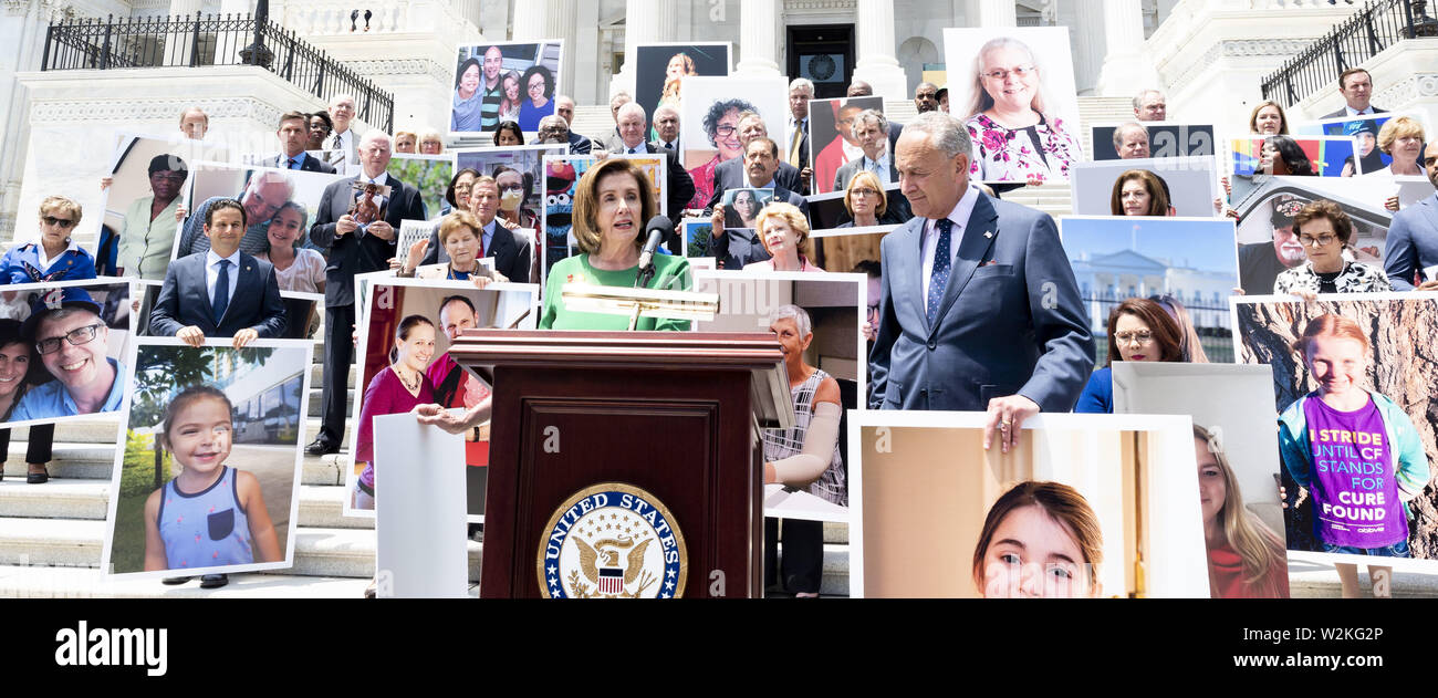 Washington, D.C, USA. 9th July, 2019. U.S. Representative NANCY PELOSI (D-CA) in front of a group of Democratic Senators and Representatives on the steps of the U.S. Capitol speaking against the ''assault on protections for people with pre-existing conditions'', on the steps of the US Capitol in Washington, DC on July 9, 2019. Credit: Michael Brochstein/ZUMA Wire/Alamy Live News Stock Photo