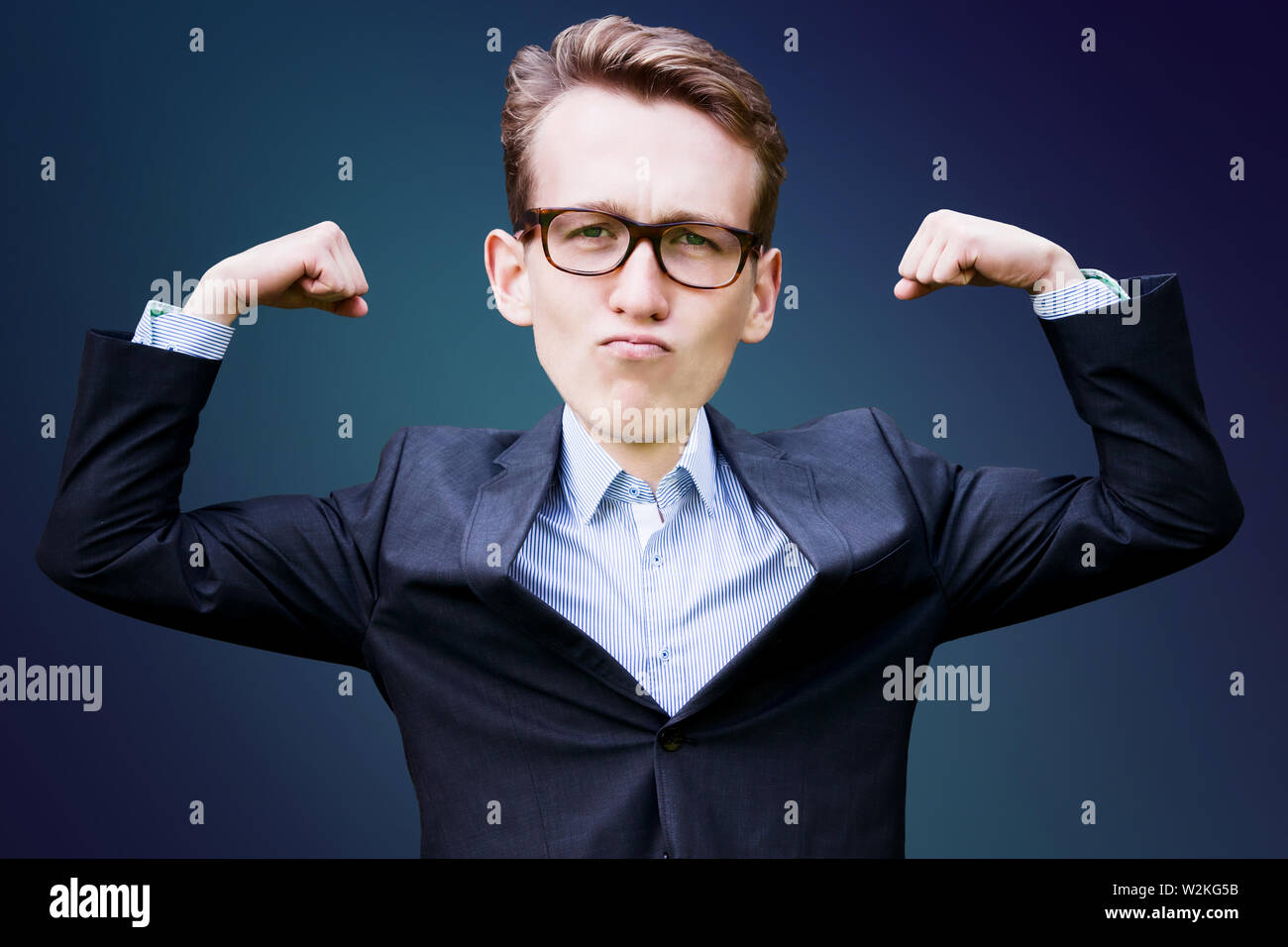 portrait of young man with big head  in suit flexing his muscles Stock Photo