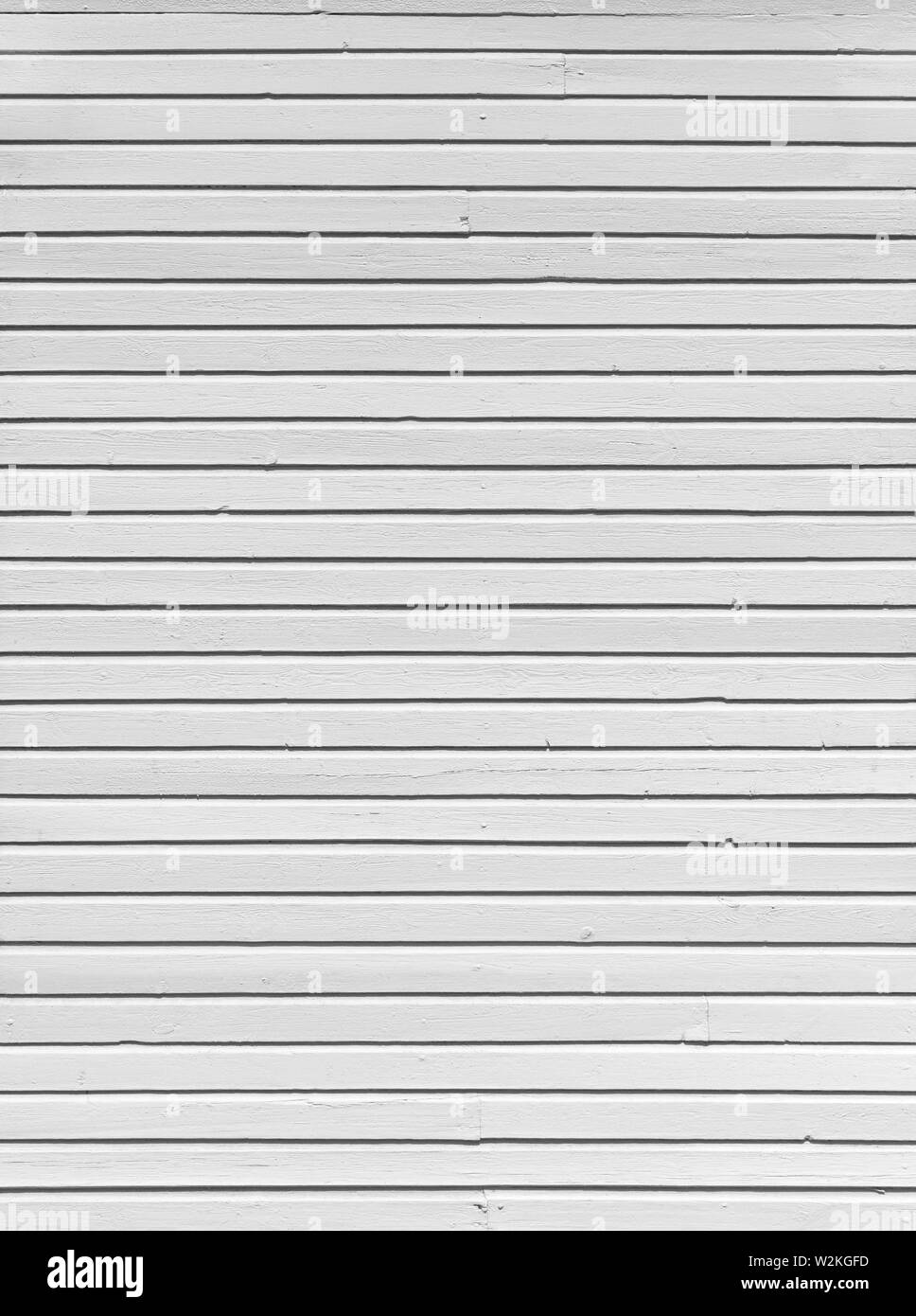 Clean wood board wall painted in white, textured background in black and white. Stock Photo