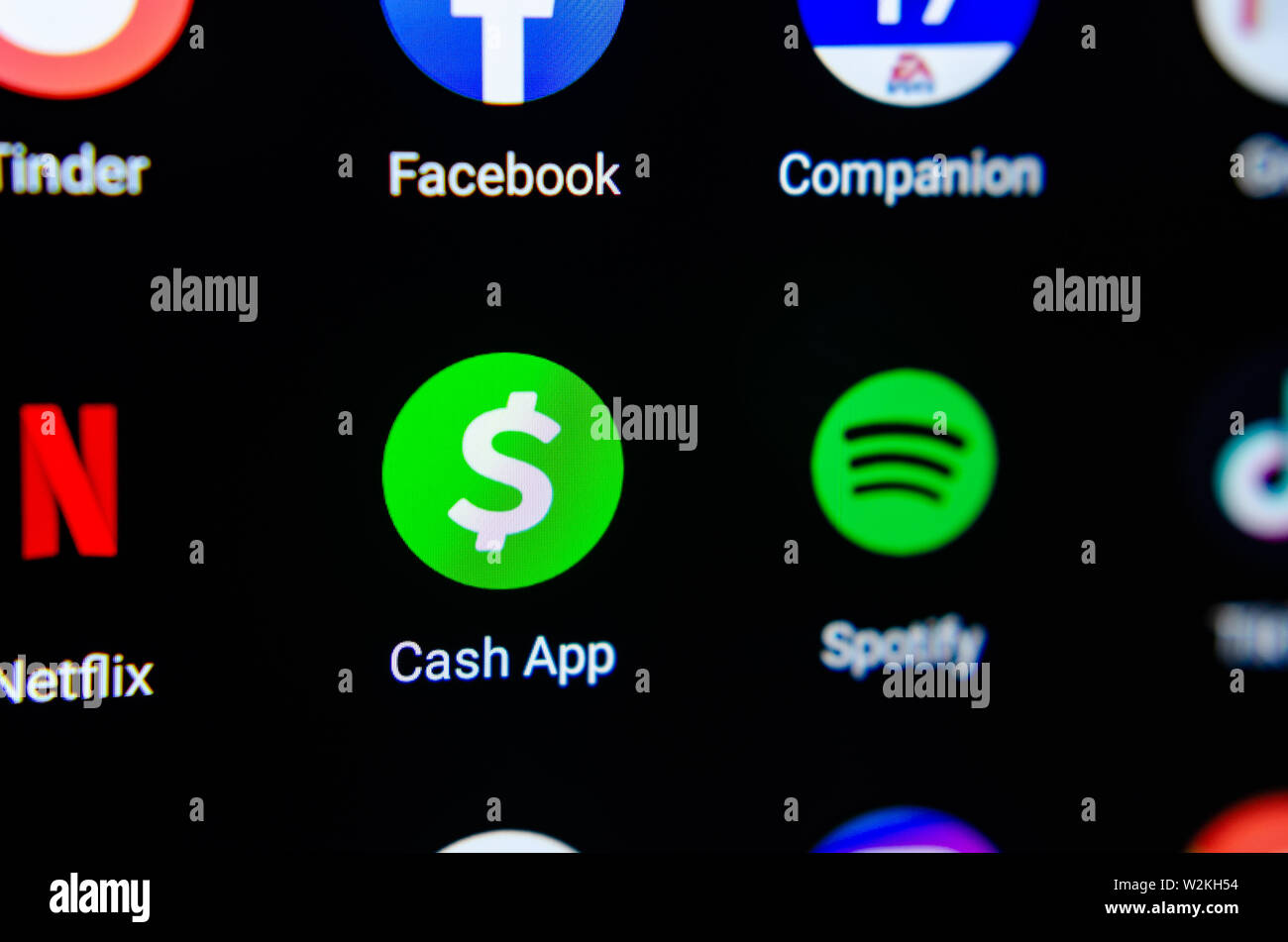 Cash App icon image on the smartphone screen. Macro photo. App for sending money instantly. Stock Photo
