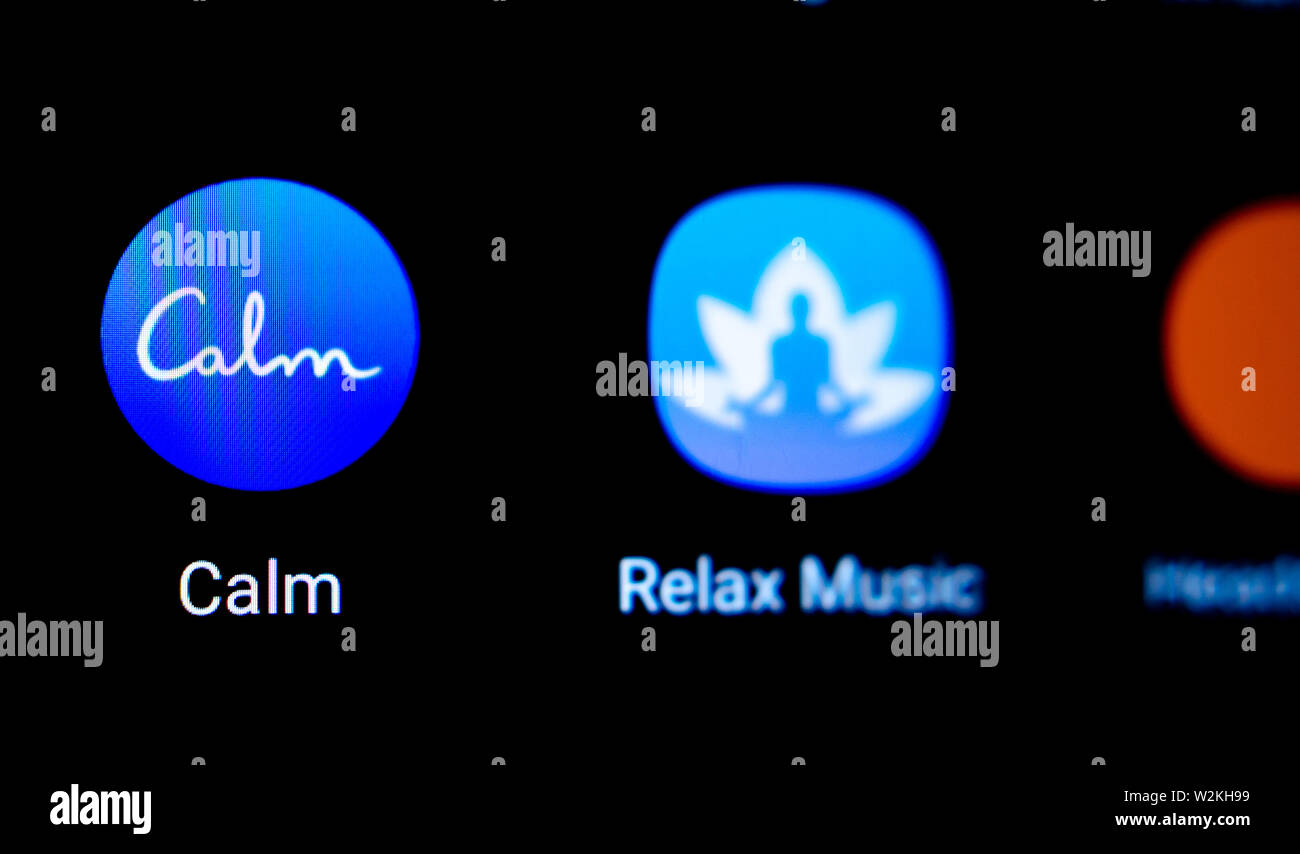 Calm app icon on the smartphone. Macro photo. App that helps to ease anxiety and stress. Stock Photo