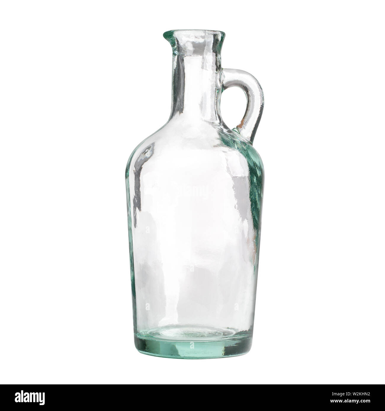 Antique glass jar for olive oil isolated on white background, front