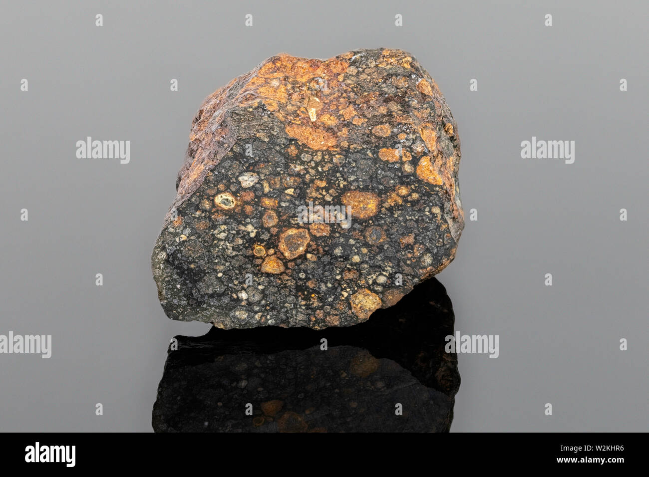 Carbonaceous Chondrite Meteorite (CV3) formed by accretion of dust, small grains and calcium-aluminum-righ inclusions (CAIs) in the early Solar System Stock Photo