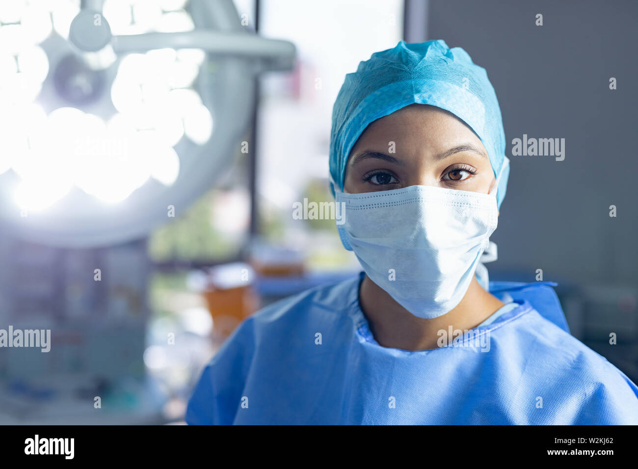 Female surgeon standing in operation room at hospital Stock Photo - Alamy