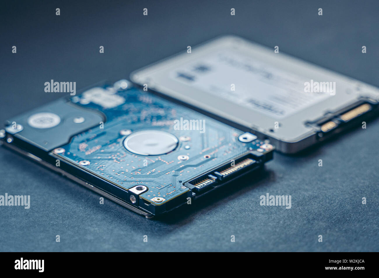 SSD drive and 2.5 HDD drive. Solid State Drive vs traditional HDD,  isolated. Fast storage device vs slow Stock Photo - Alamy