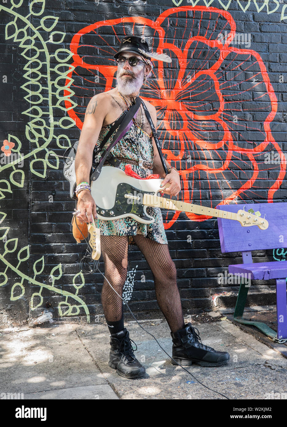 a portrait of an eccentric adult man dressed in unusual clothes on south street in south philadelphia Stock Photo