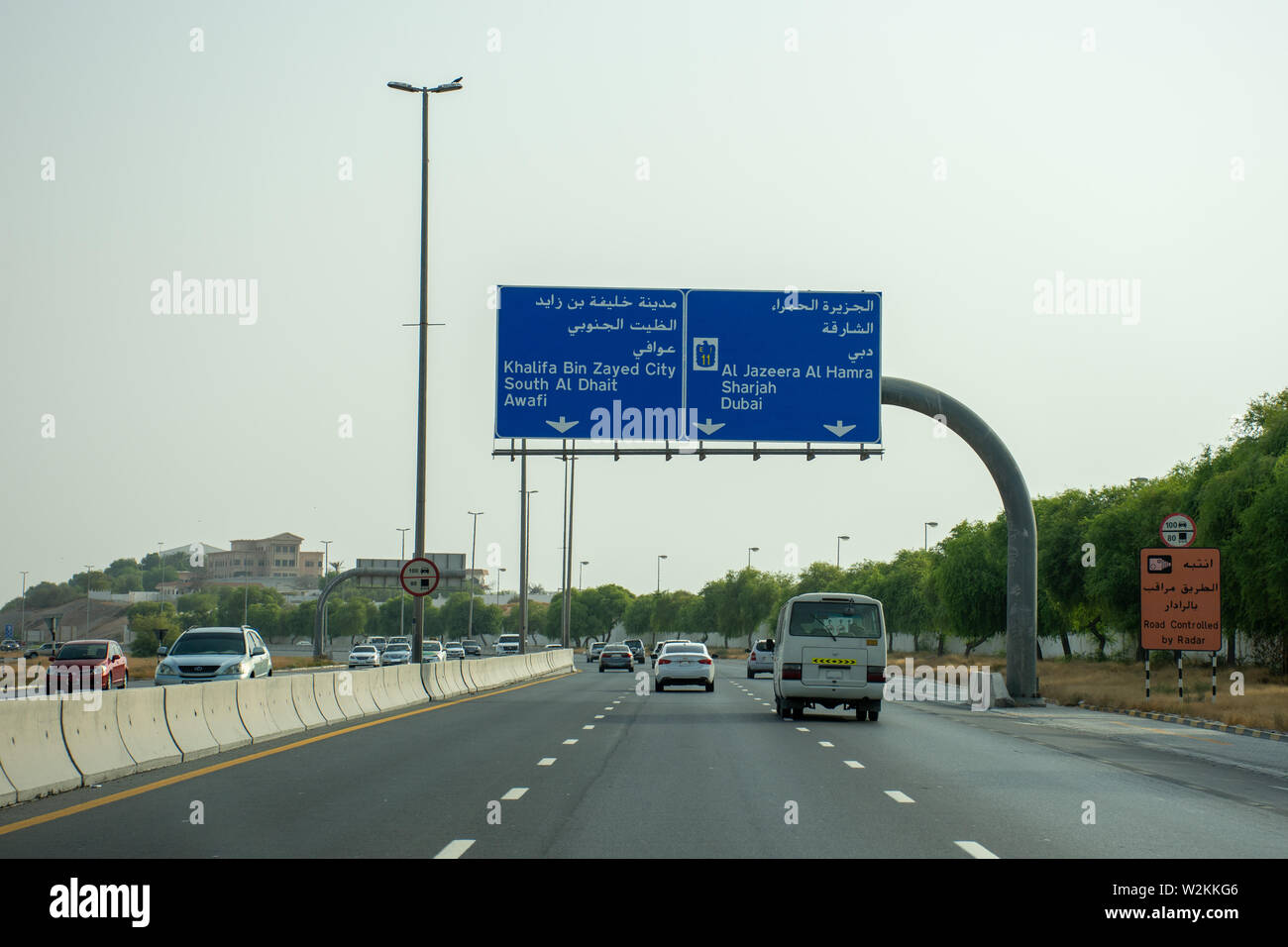 'Ras al Khaimah, Ras al Khaimah/United Arab Emirates - 7/4/2019: Highway in RAK on the E11 looking at a sign to Al Dhait or Al Jazeera Al Hamra on a q Stock Photo