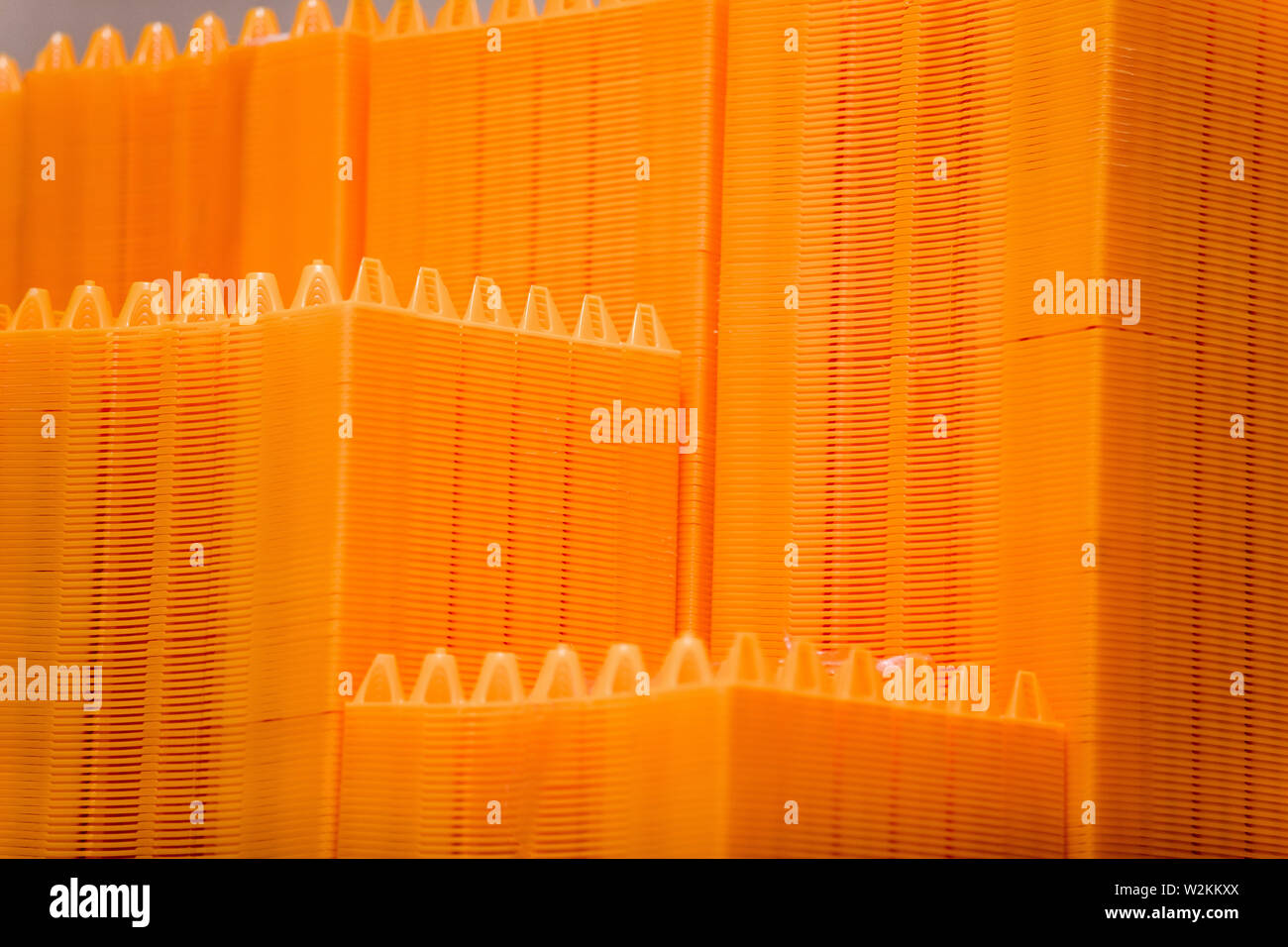 Stack of empty plastic egg trays in warehouse Stock Photo