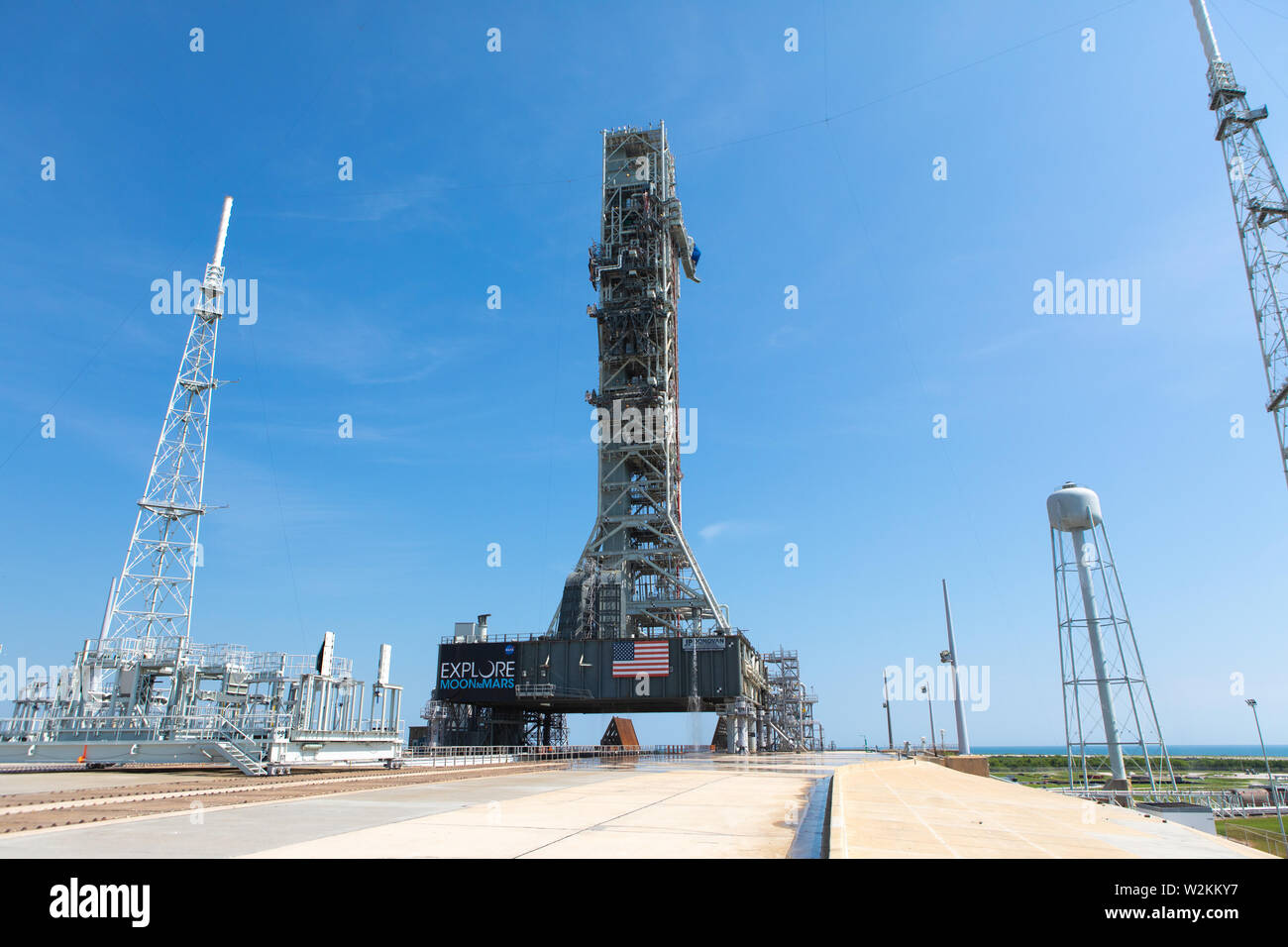 The NASA Orion Exploration Ground Systems conducts a water flow test with the mobile launcher at Kennedy Space Center July 2, 2019 in Cape Canaveral, Florida. The test is the first of nine to verify the sound suppression system is ready for launch of the first Artemis mission. Stock Photo