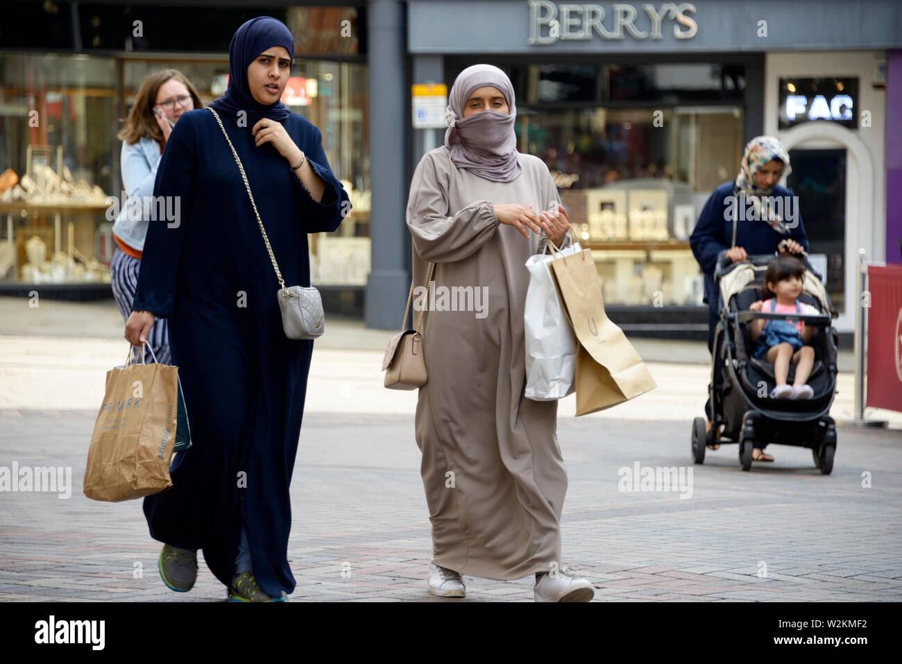 Muslim women, one with Niqab, walking in the street Stock Photo - Alamy