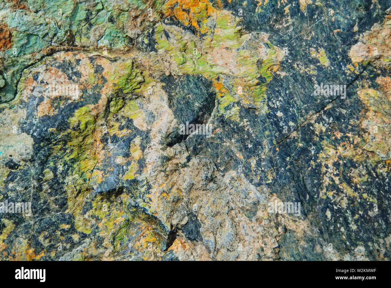 Natural Surface texture of serpentinite. Background with green mineral ...