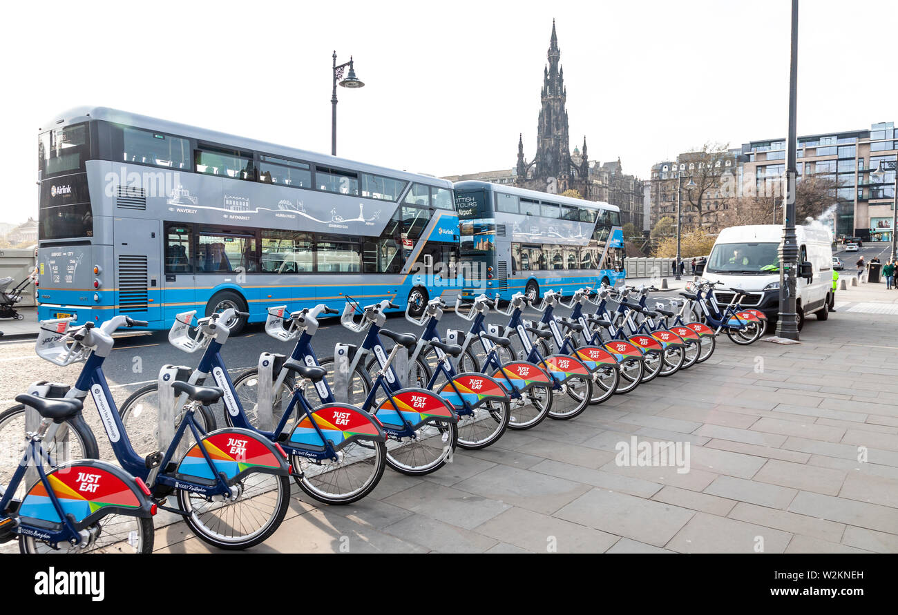 Transport for Edinburgh (Just Eat) bicycles and two double decker