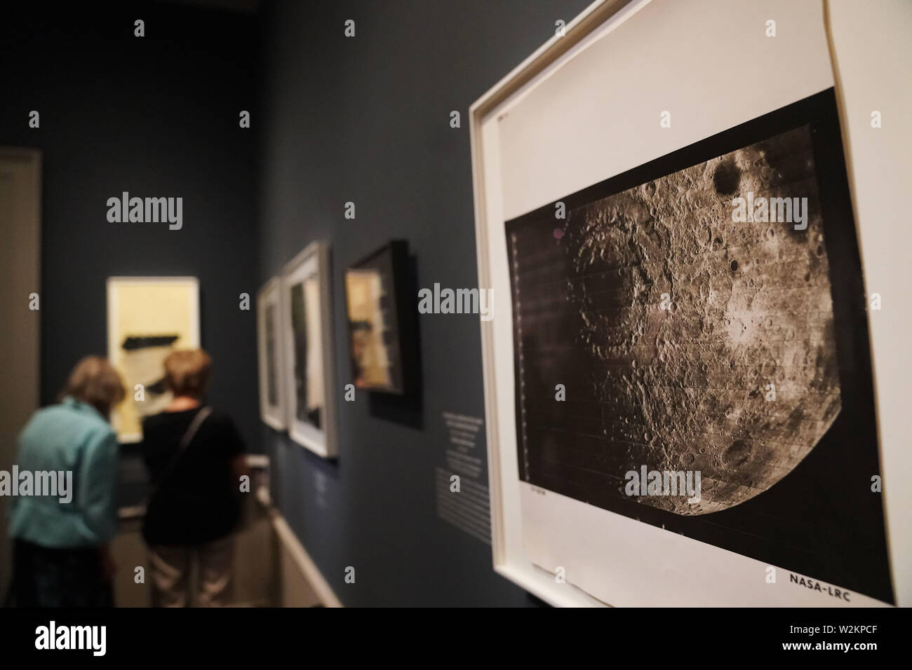 Washington, USA. 9th July, 2019. Visitors view exhibits during a preview of 'By the Light of the Silvery Moon: A Century of Lunar Photographs' at the National Gallery of Art in Washington, DC, the United States, on July 9, 2019. Some 50 works including a selection of photographs will be displayed in the exhibition lasting from July 14, 2019 through Jan. 5, 2020 to mark the 50th anniversary of the Apollo 11 moon landing. Credit: Liu Jie/Xinhua/Alamy Live News Stock Photo